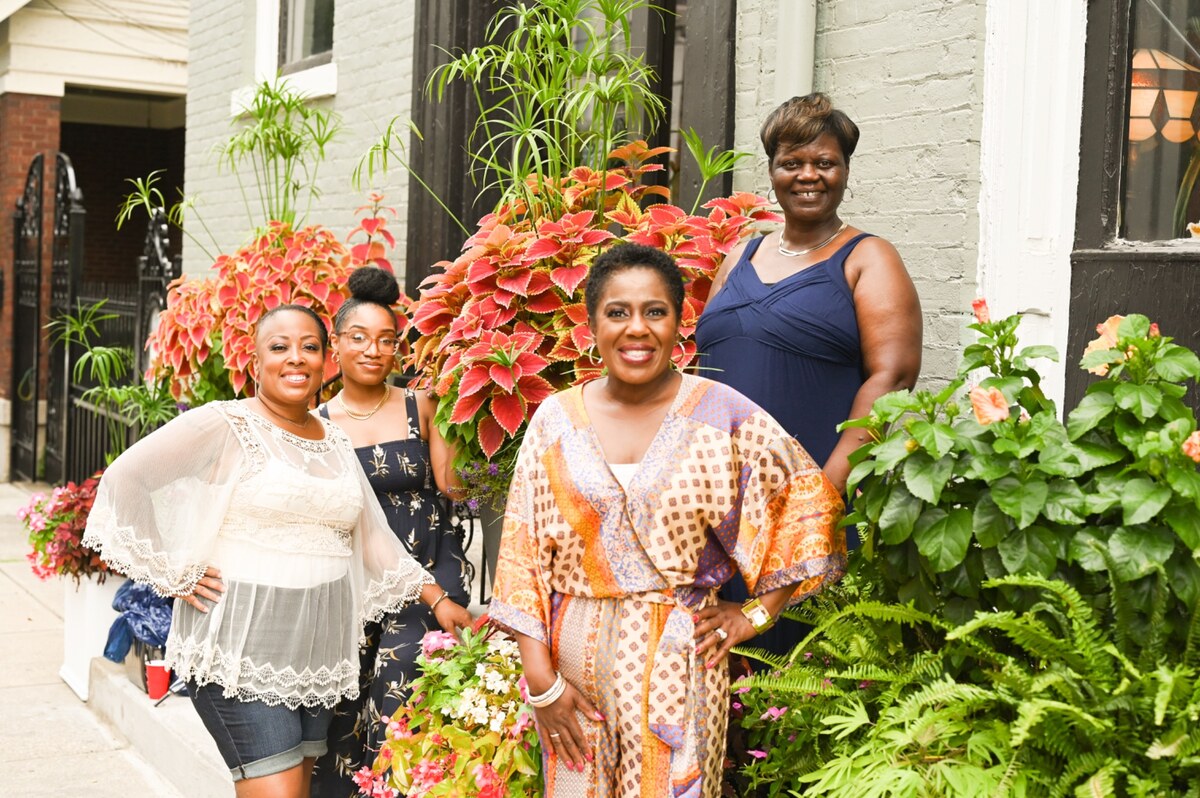 Women gathered outdoors as a Wisdom and Grace community